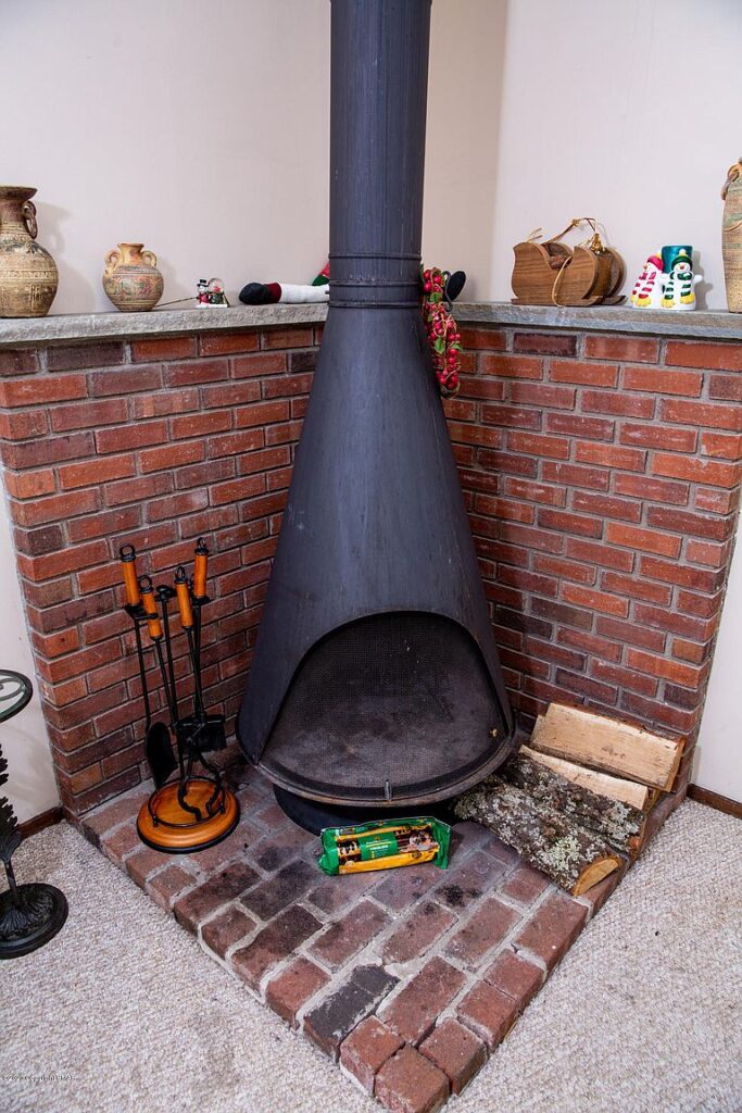 Fireplace before renovated mountain vacation home